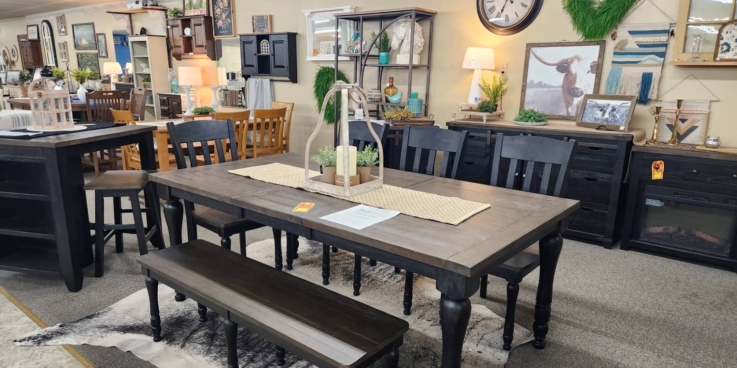 Black farmhouse dining tables and benches on the first floor at Thieves Market